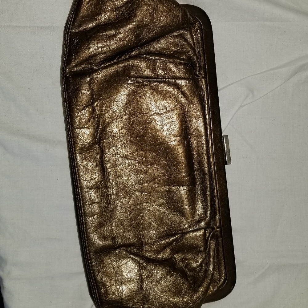 b8,217 Hobo International Brown Leather Clutch